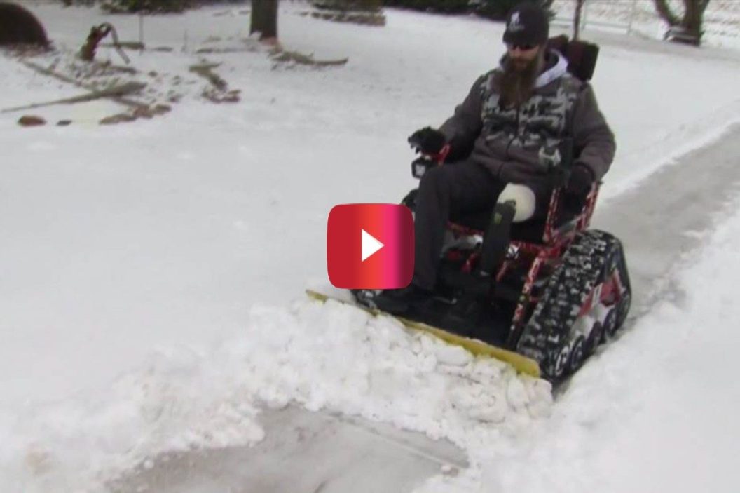 veteran plows snow with wheelchair