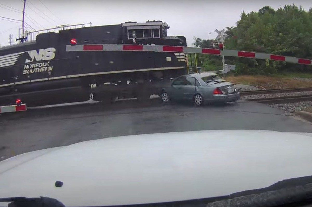 Train Plows Through Car After It Stalls on Tracks - alt_driver