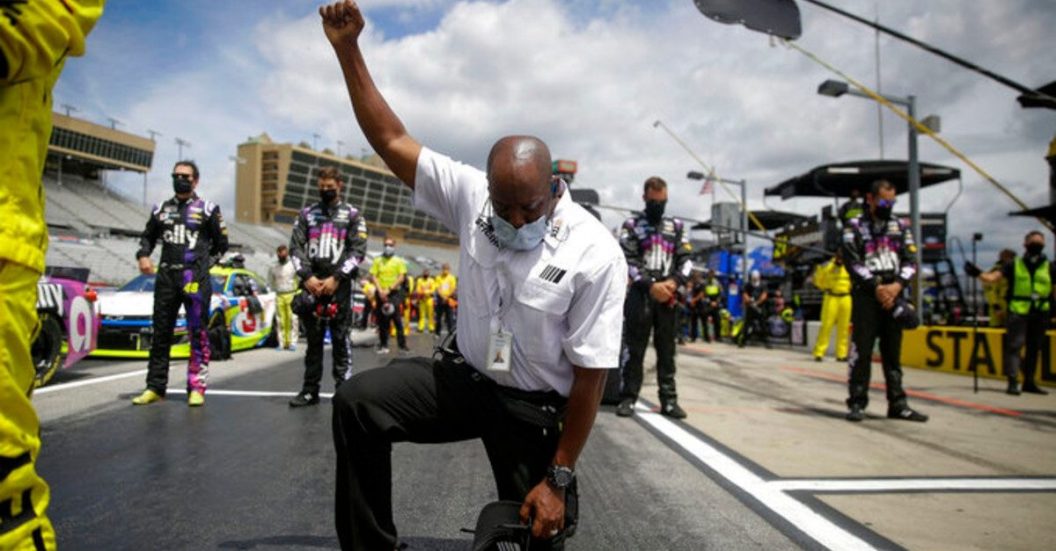 nascar official kneeling