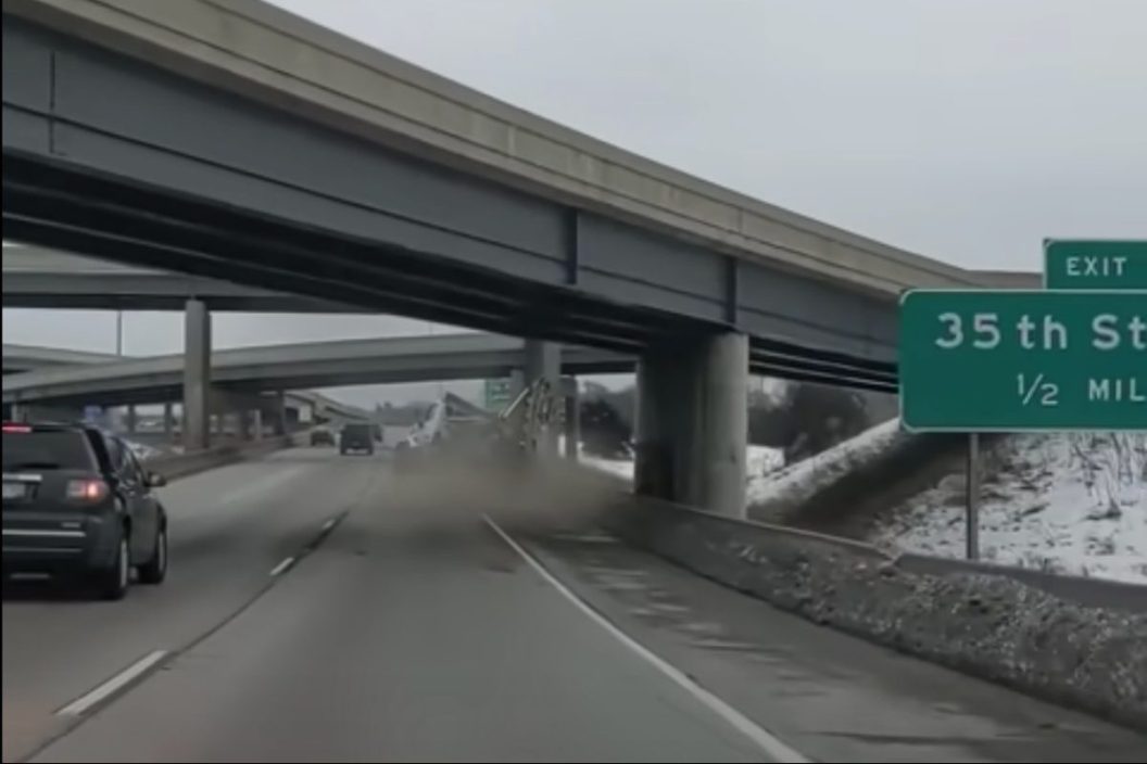 semi truck topples after hitting bridge